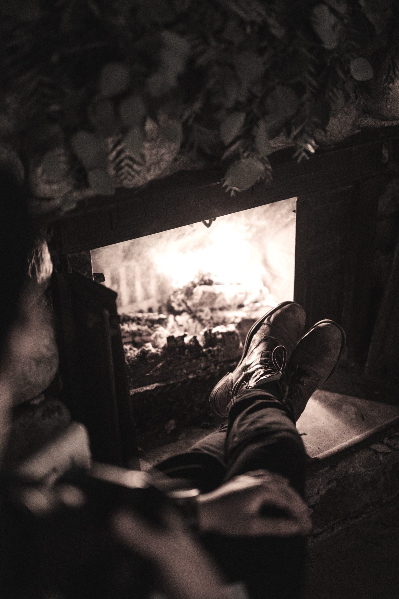 sitting by a fireplace